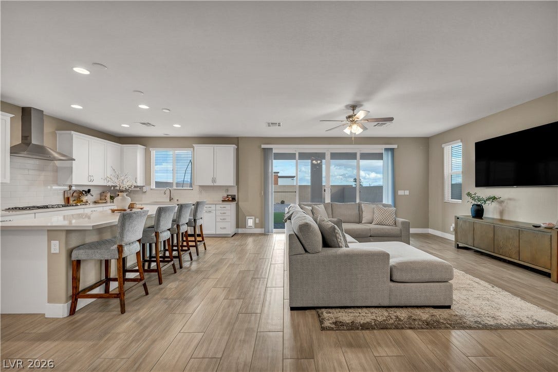 7128 Port Stephens Street, North Las Vegas, NV 89084 An open floorplan seamlessly connects the central living area to the adjacent kitchen.