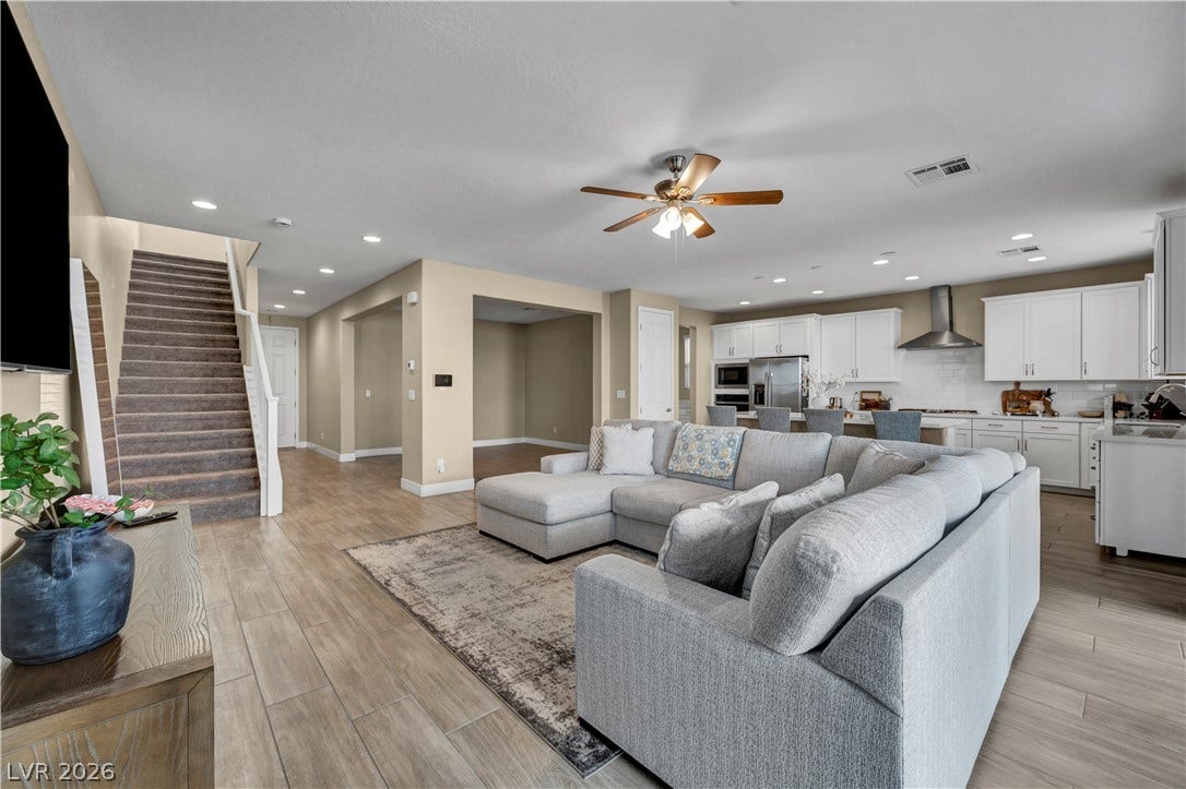 7128 Port Stephens Street, North Las Vegas, NV 89084 An open floorplan design seamlessly connects the spacious living area to a modern kitchen.
