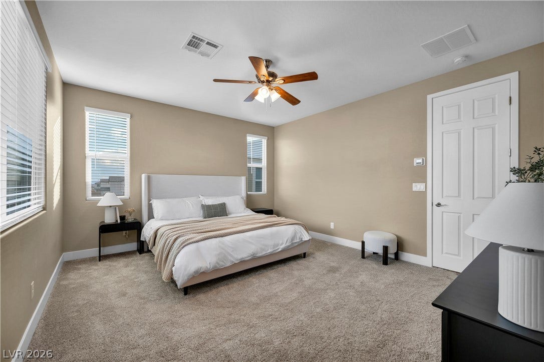 7128 Port Stephens Street, North Las Vegas, NV 89084 Generous window placements illuminate a well-proportioned sleeping space finished with soft carpeting.