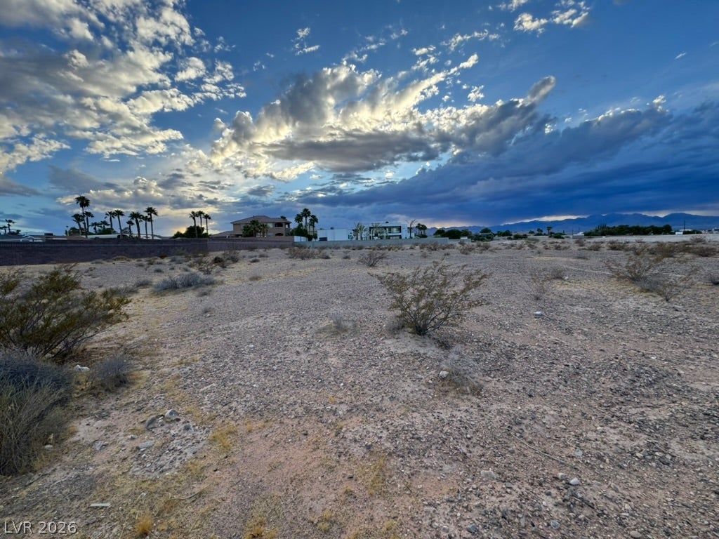 Mohawk, Las Vegas, NV 89118 A spacious desert parcel stands ready for development under a dramatic mountain backdrop.