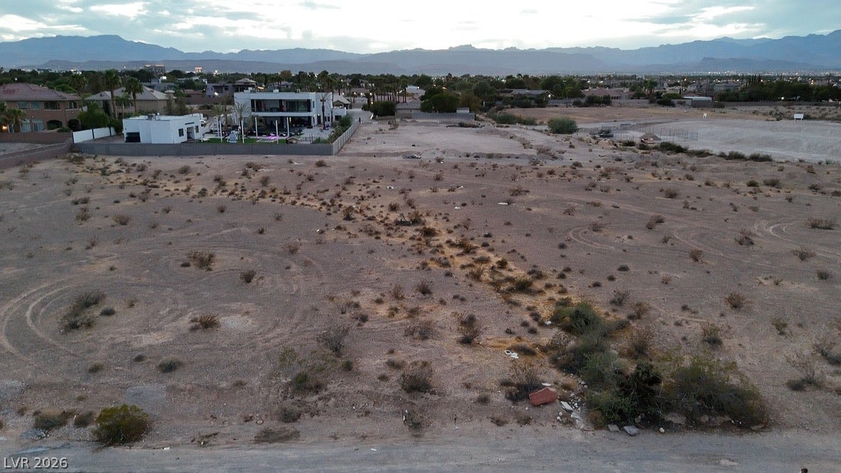 Mohawk, Las Vegas, NV 89118 Distant mountain ranges frame this expansive desert lot offering endless development possibilities.