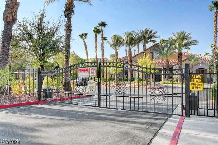 2300 E Silverado Ranch Boulevard, #1077, Las Vegas, NV 89183 Secure gated access provides peace of mind in this beautifully landscaped desert community.