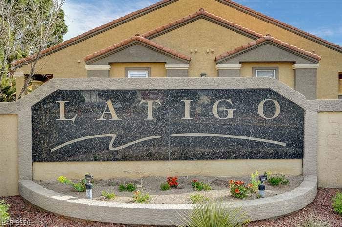2300 E Silverado Ranch Boulevard, #1077, Las Vegas, NV 89183 A stone monument sign marks the entrance to this residential community.
