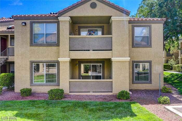 2300 E Silverado Ranch Boulevard, #1077, Las Vegas, NV 89183 Stucco exteriors frame private outdoor spaces beneath a classic tiled roofline.