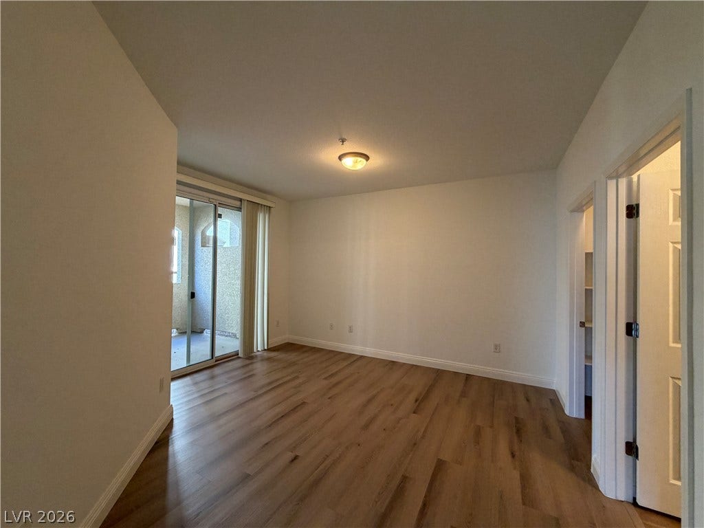 8777 W Maule Avenue, #1158, Las Vegas, NV 89148 Gleaming hardwood floors and a sliding glass door lead to the private outdoor balcony.