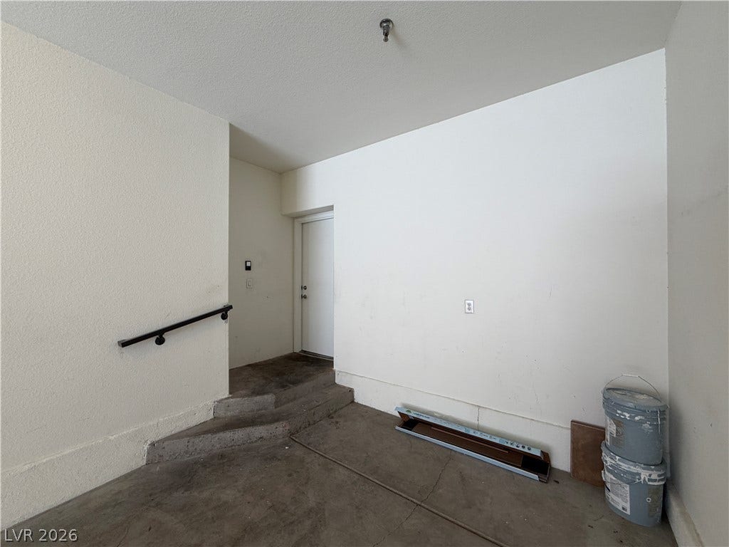 8777 W Maule Avenue, #1158, Las Vegas, NV 89148 Concrete steps lead up to a private entry door from the spacious garage area.