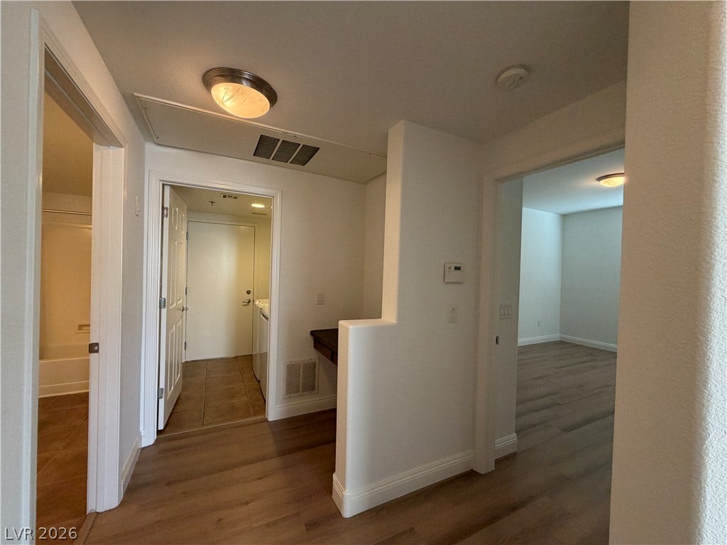 8777 W Maule Avenue, #1158, Las Vegas, NV 89148 Smooth wood-look flooring connects seamlessly through open doorways to adjacent living spaces.