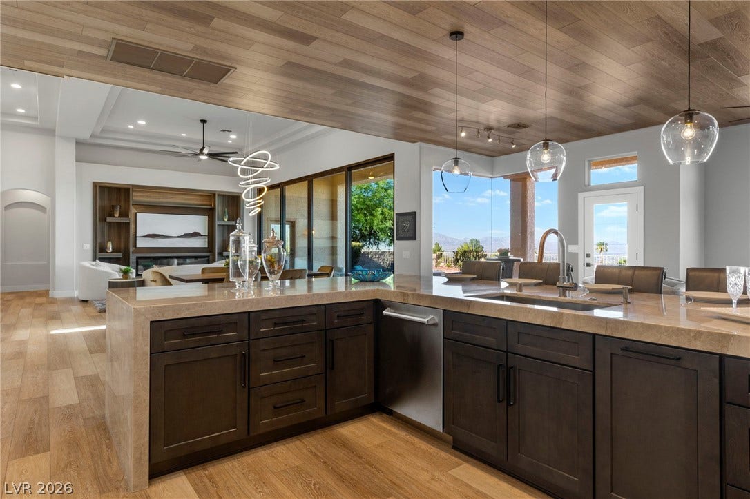 Reverse Kitchen Shot Across the Great Room....Views for as Far as the Eye can see....Custom Finished Ceiling with the Matching Floor Product.....
