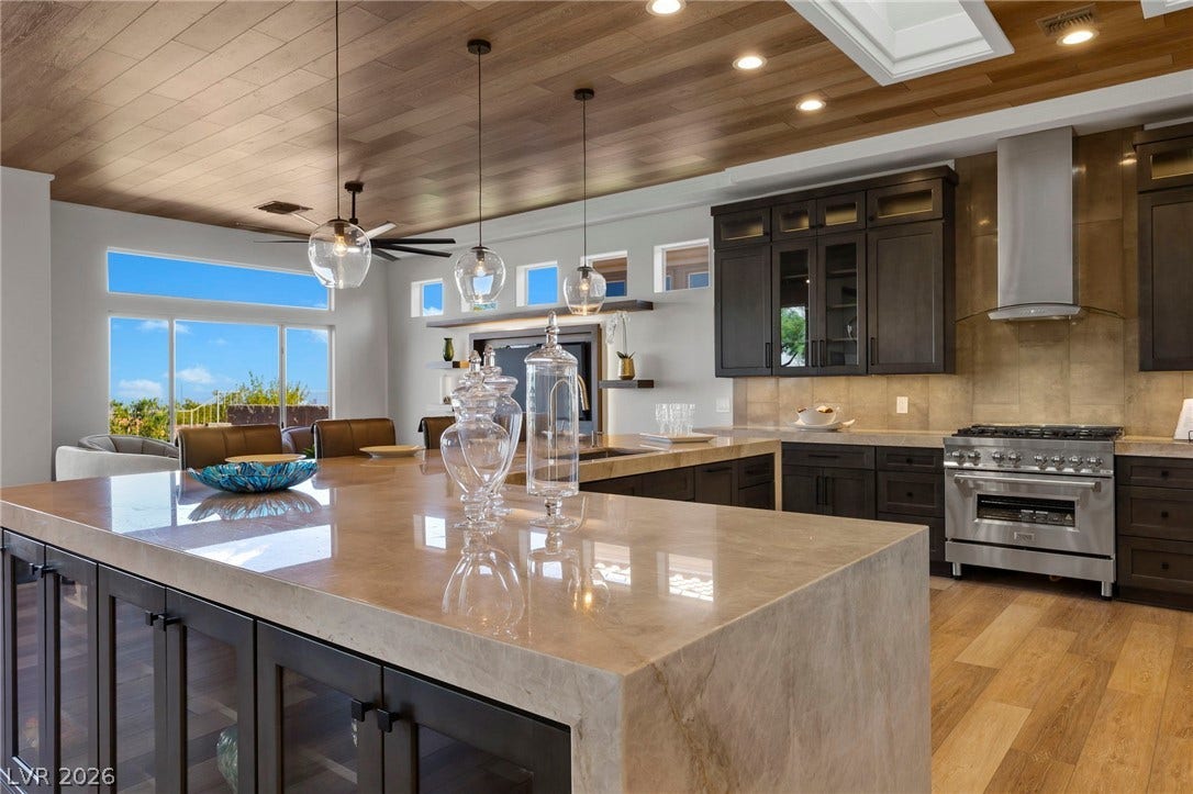 The Gourmet Kitchen Floating Island Featuring Quartz Wrapped Double Ended Waters Falls.....