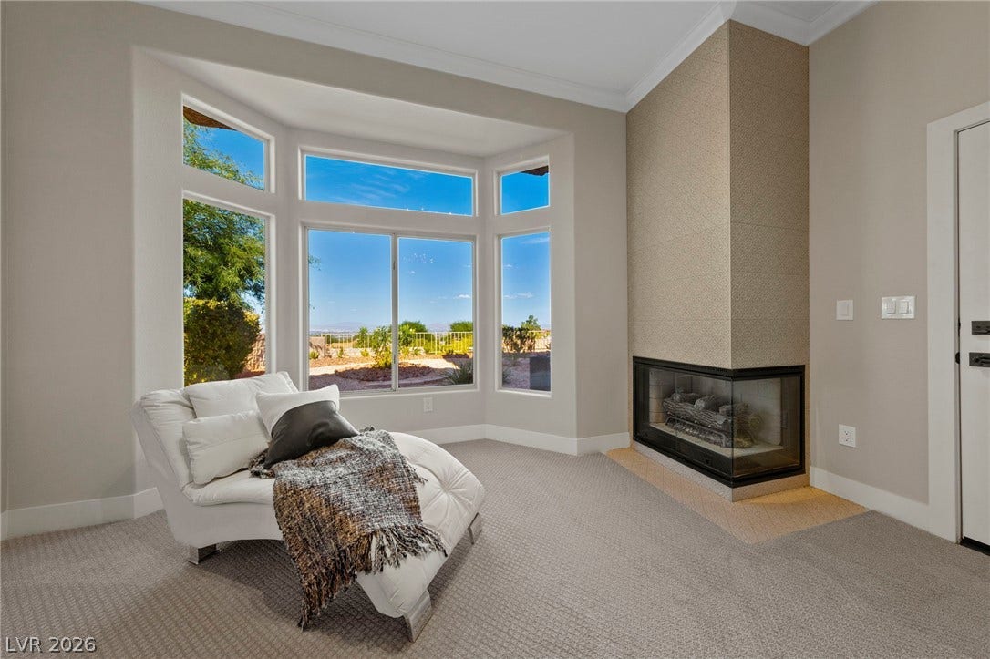 Master Sitting Area with Two Sided Fireplace and Sweeping Valley Wide Views....