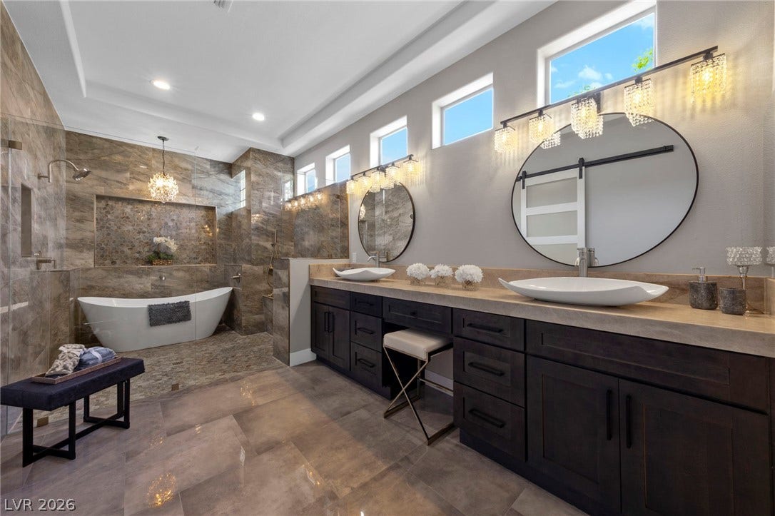 Designer Bathroom with a Three Station Wet Shower....Dual Vanity with a Makeup Space....
