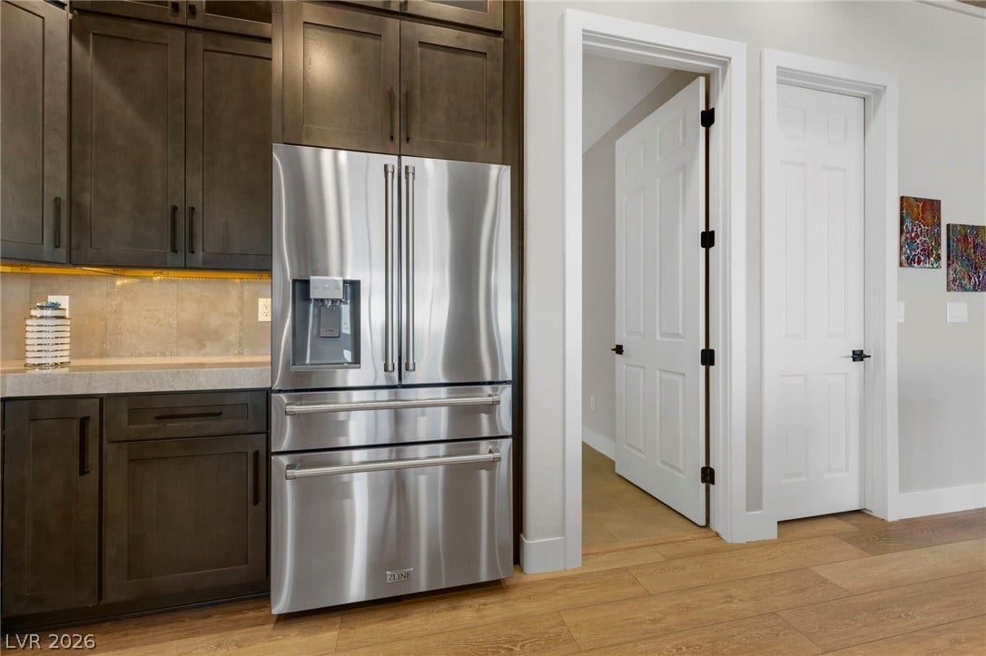 Ease of Access to the Laundry Room Right off the Kitchen.....The Door Next to the Laundry Room is the Walk-In Pantry.....