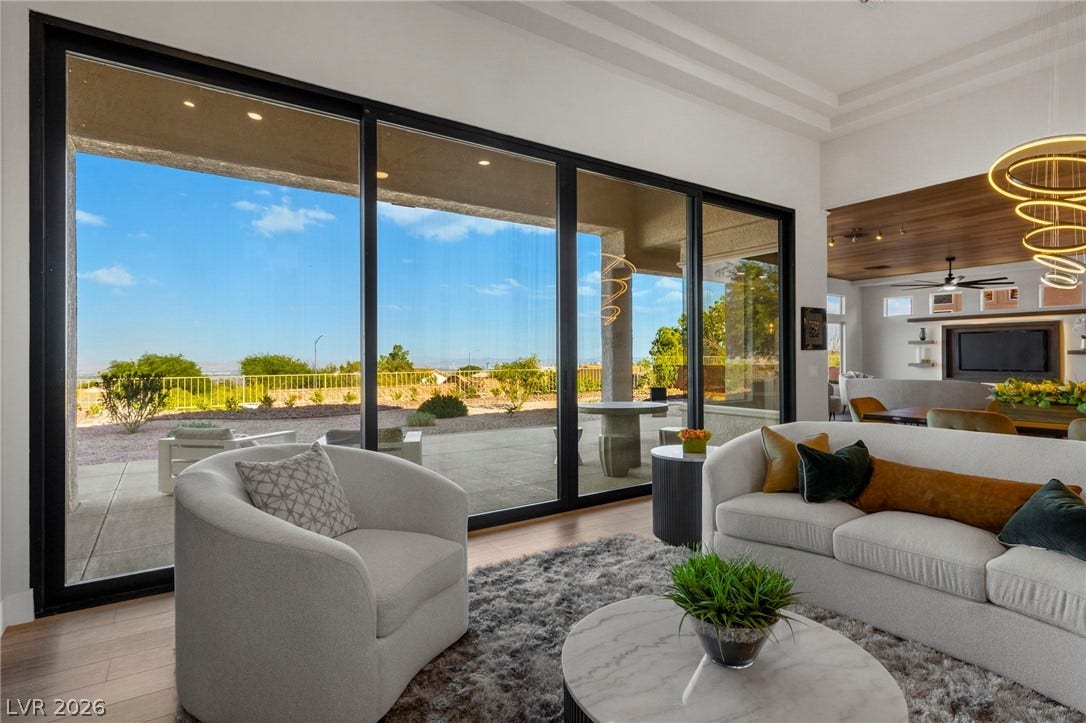 Custom Built Window Wall featuring Picturesque Desert Blue Skies with Over Sized Patio Area....