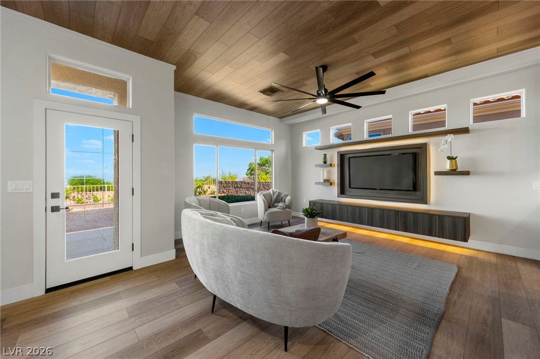 Family Room with a Custom Built Entertainment Center Complete With LED Lighting Specially Sized for a 65" TV.....