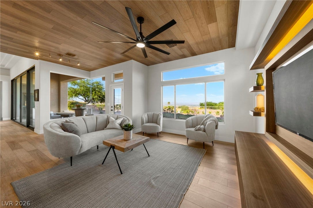 Boutique Entertainment Center Area Directly off the Kitchen with Custom Built Mill Work and LED Lighting....