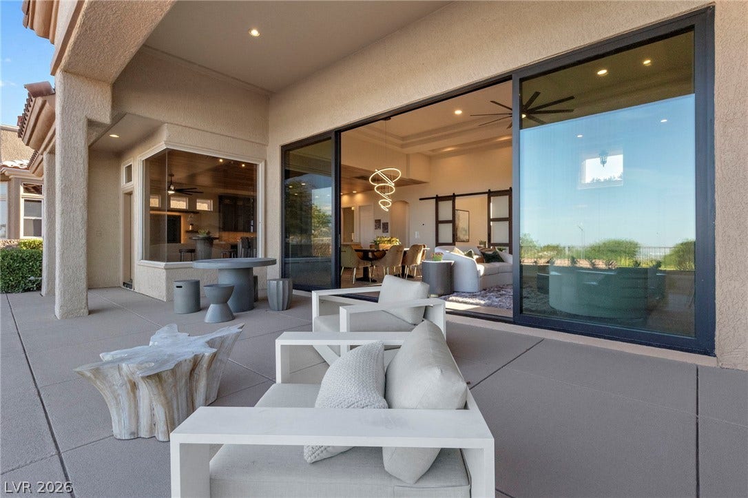 Patio Living at its Best....Great Shot of the Window Wall Opened into the Great Room.....