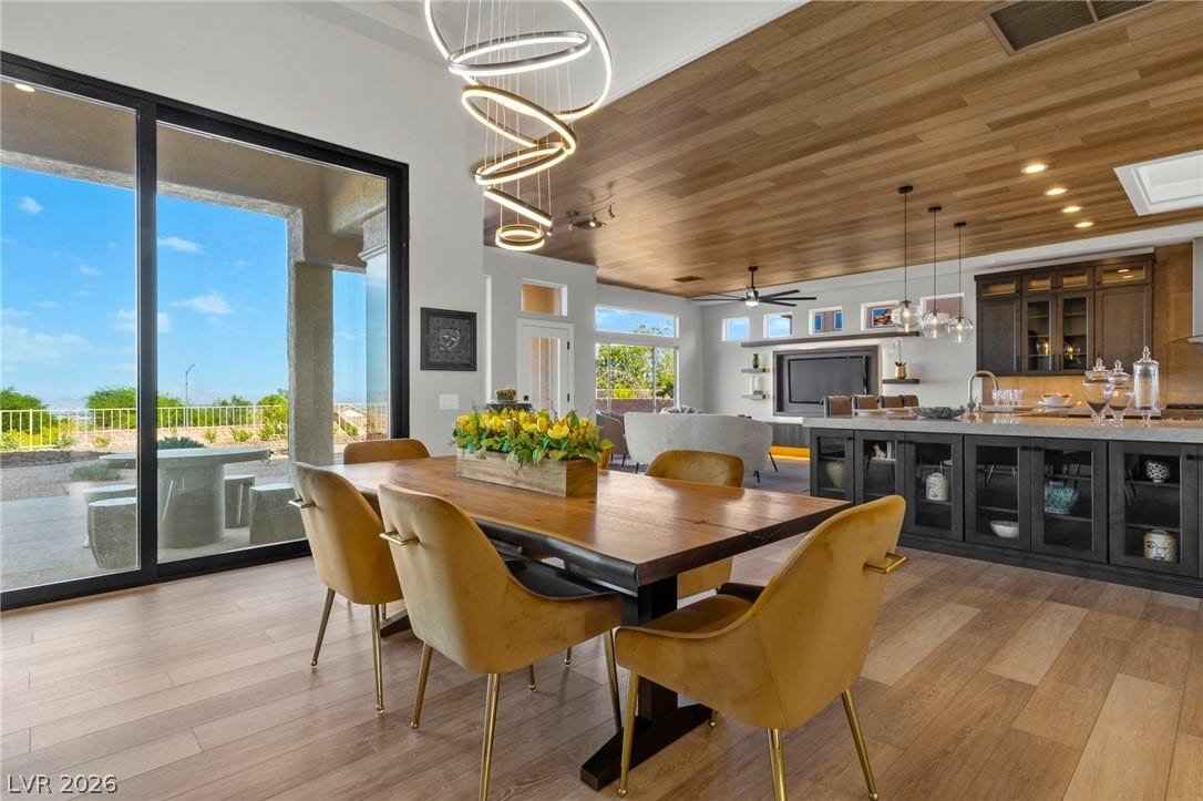 Dining Area Featuring a Below Counter Curio Cabinet Complete with Custom LED Lighting....