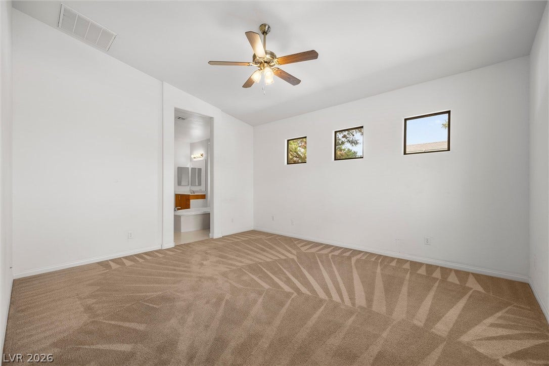5824 Pleasant Palms Street, North Las Vegas, NV 89081 Bedroom 3 upstairs with Loft. High ceilings and soft carpeting define this spacious room with elevated windows.