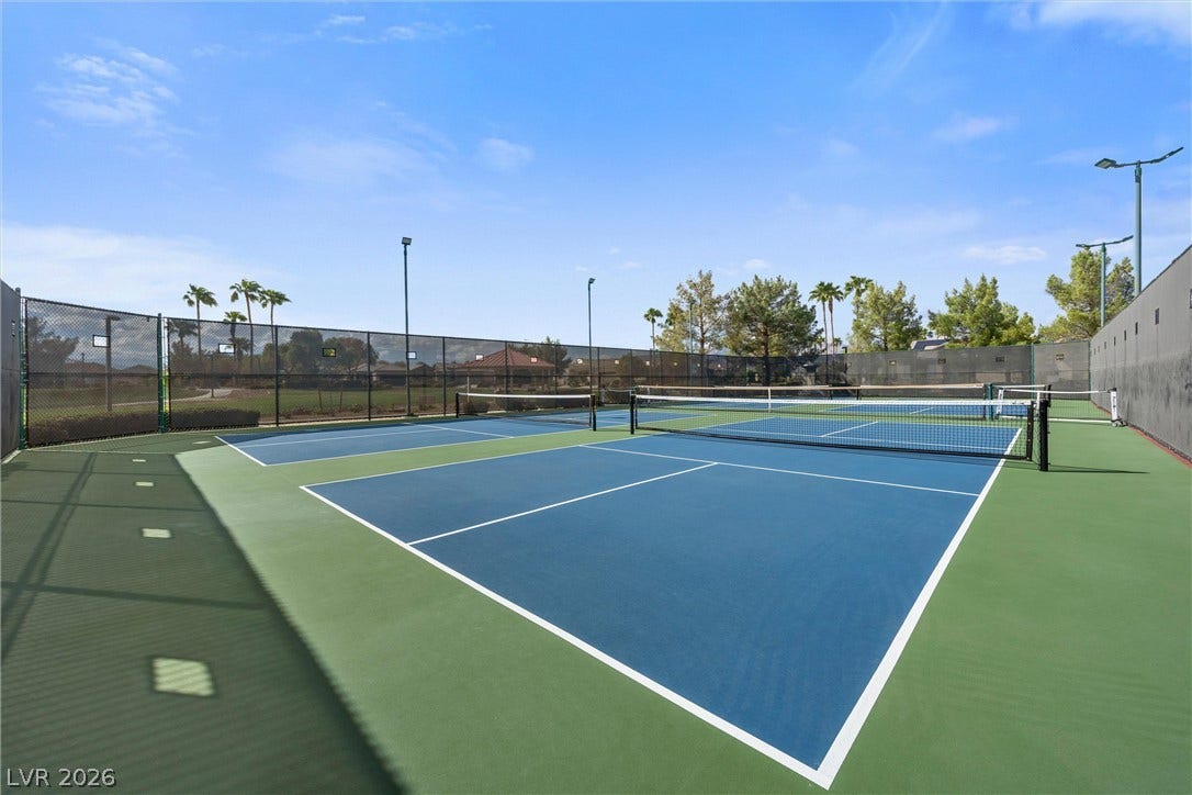 5824 Pleasant Palms Street, North Las Vegas, NV 89081 Fenced courts offer outdoor recreation options under wide open skies.