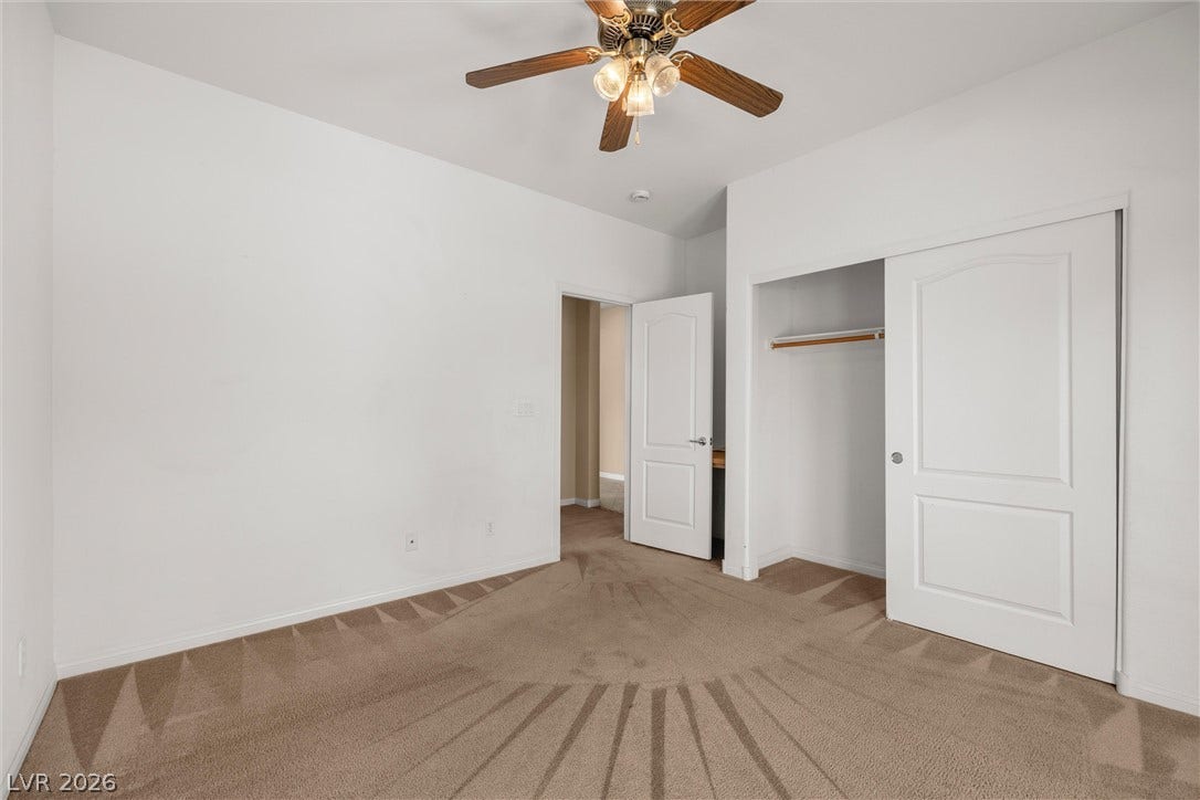 5824 Pleasant Palms Street, North Las Vegas, NV 89081 Bedroom 2 down stairs: Plush carpeting and neutral walls define this comfortable bedroom space.