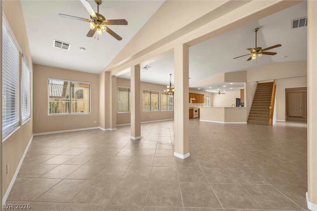 5824 Pleasant Palms Street, North Las Vegas, NV 89081 Tiled flooring and soaring ceilings define this light-filled, open-concept living space.