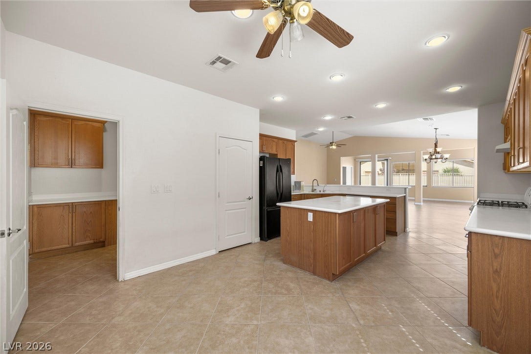 5824 Pleasant Palms Street, North Las Vegas, NV 89081 An open floorplan seamlessly connects the functional kitchen to adjacent living spaces.