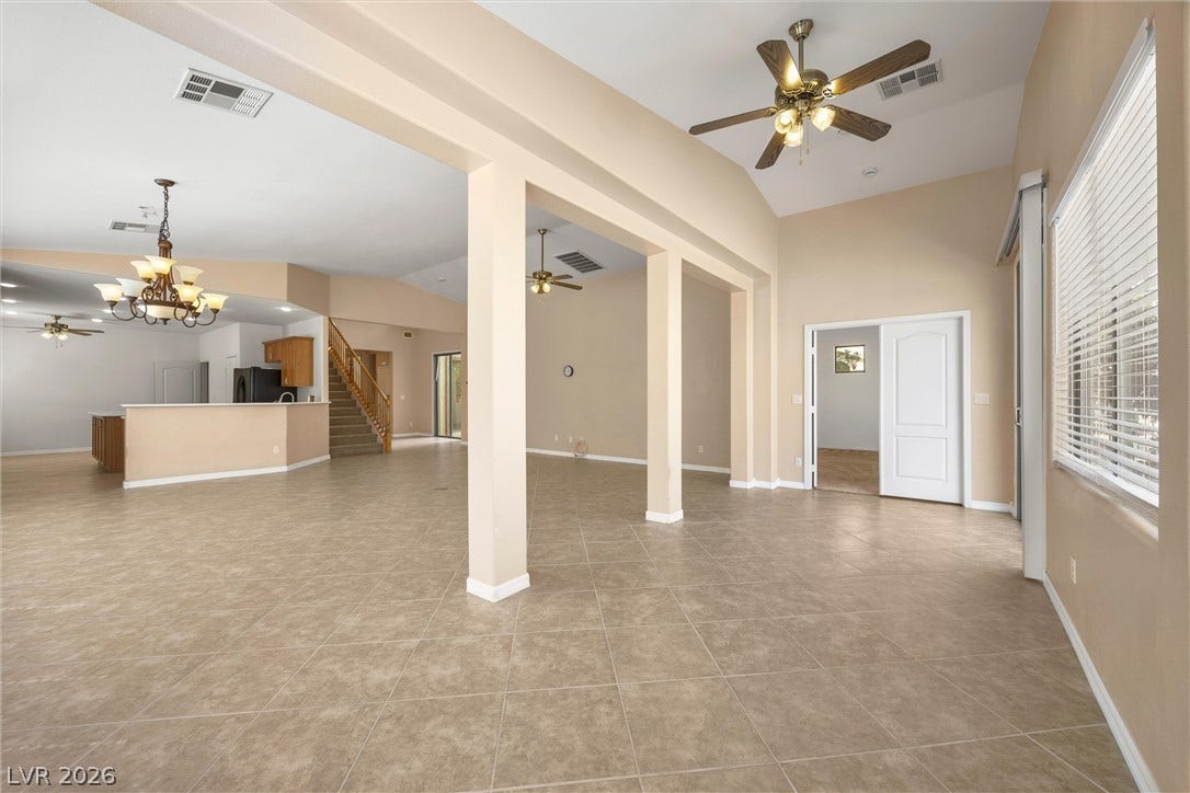 5824 Pleasant Palms Street, North Las Vegas, NV 89081 An open floorplan showcases soaring ceilings and clean tile flooring throughout the main level.