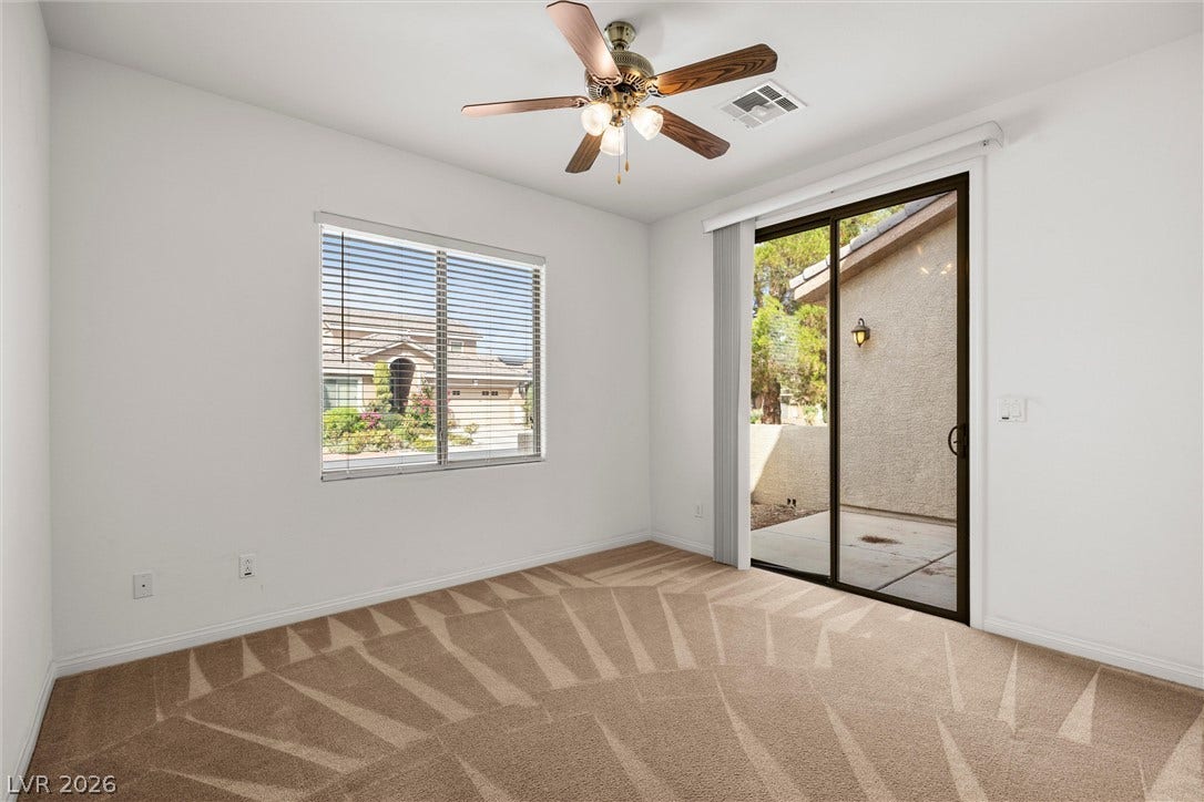 5824 Pleasant Palms Street, North Las Vegas, NV 89081 Den on 1st floor next to bedroom: Sliding glass doors open directly to a private patio from this comfortable carpeted space.