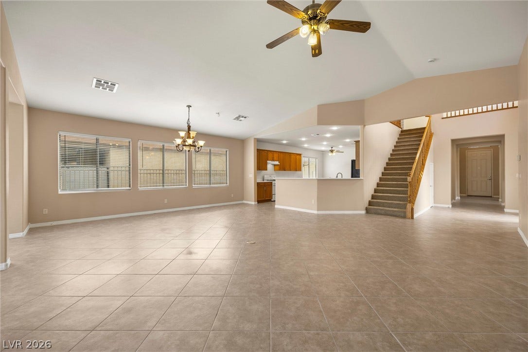 5824 Pleasant Palms Street, North Las Vegas, NV 89081 Ceramic tile floors and soaring vaulted ceilings define this open main-level living space.