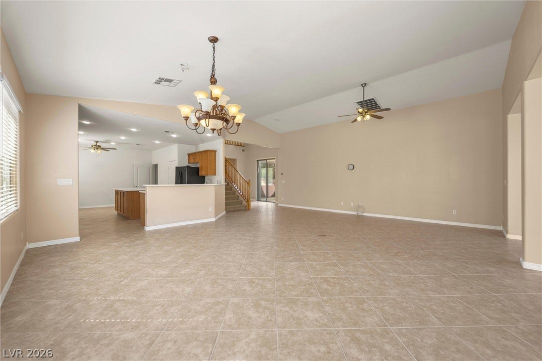 5824 Pleasant Palms Street, North Las Vegas, NV 89081 An open layout connects the spacious living area to the kitchen under vaulted ceilings.