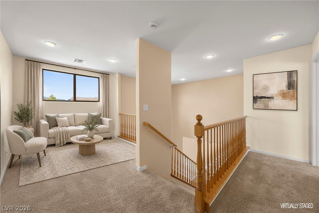 5824 Pleasant Palms Street, North Las Vegas, NV 89081 Plentiful recessed lighting illuminates a versatile upper-level landing with wall-to-wall carpeting.