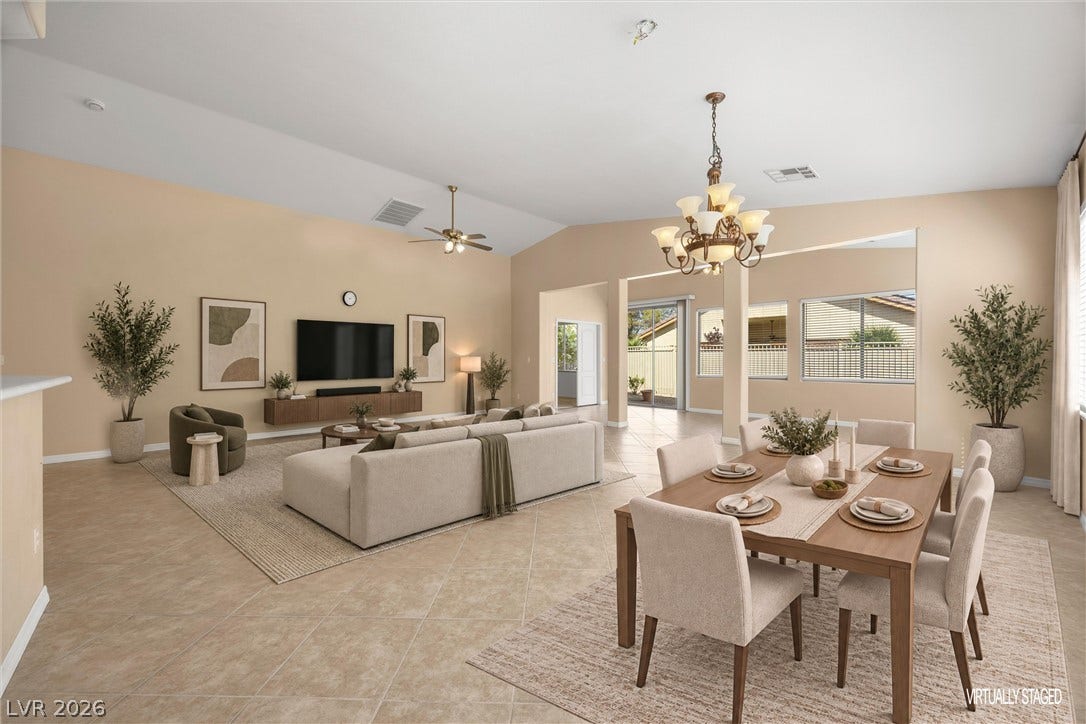 5824 Pleasant Palms Street, North Las Vegas, NV 89081 An open floorplan connects the dining space to the living area under vaulted ceilings.