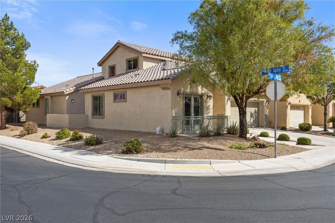 5824 Pleasant Palms Street, North Las Vegas, NV 89081 Stucco exterior and tile roofing define this modern two-story residence situated on a corner lot.