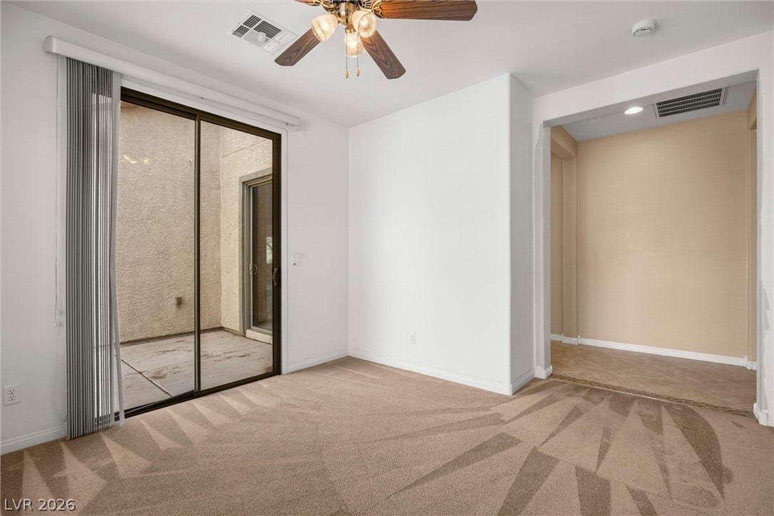5824 Pleasant Palms Street, North Las Vegas, NV 89081 Dent on 1st floor: Sliding glass doors open directly to a private concrete patio from this carpeted living space.