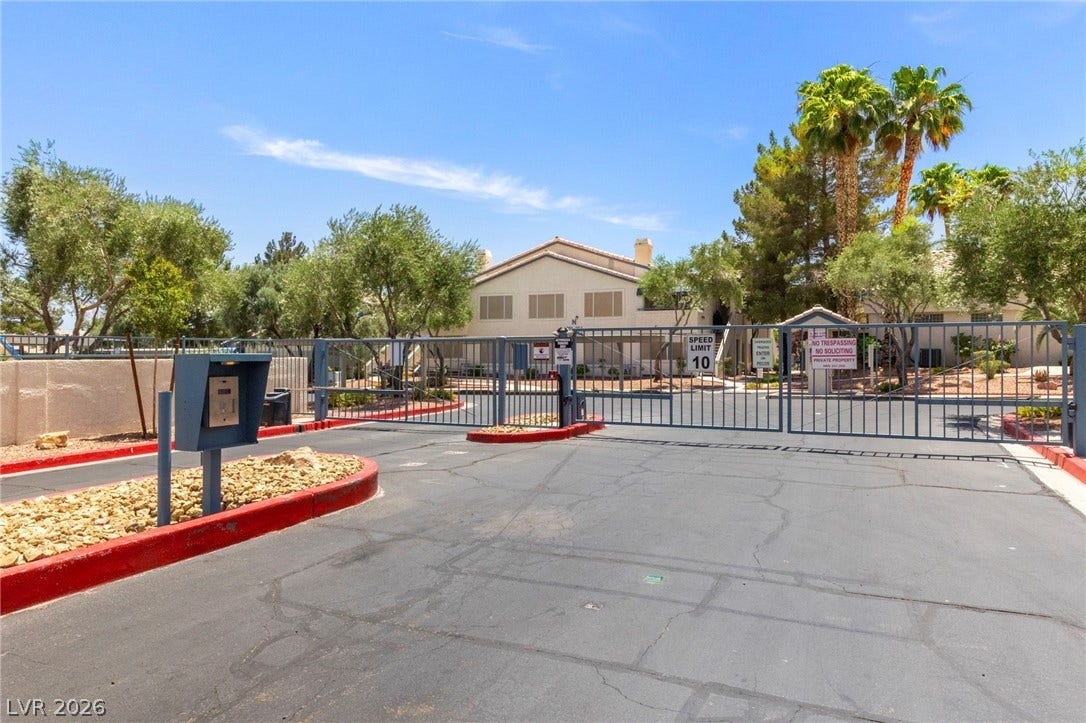 Secure gated entry welcomes residents to this beautifully landscaped residential community.