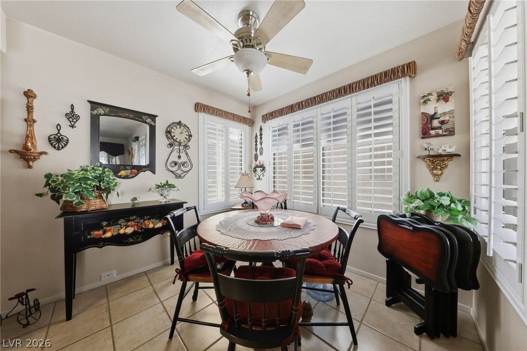 Tiled flooring and plantation shutters enhance this cozy dining area.