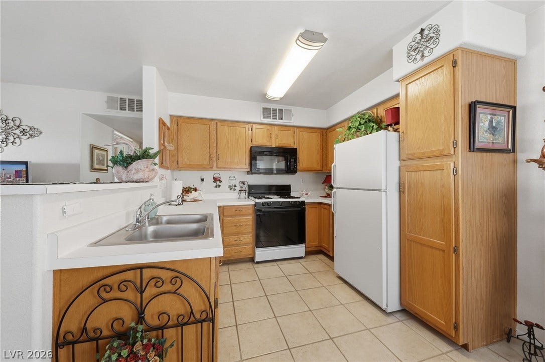 Kitchen with tile flooring.