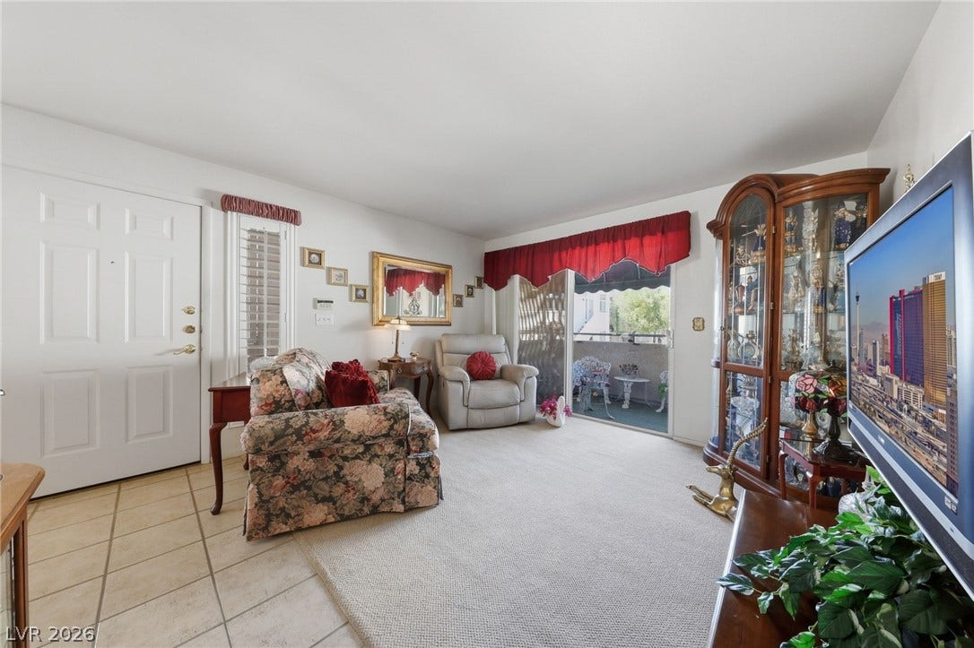 Living room opens to covered balcony.