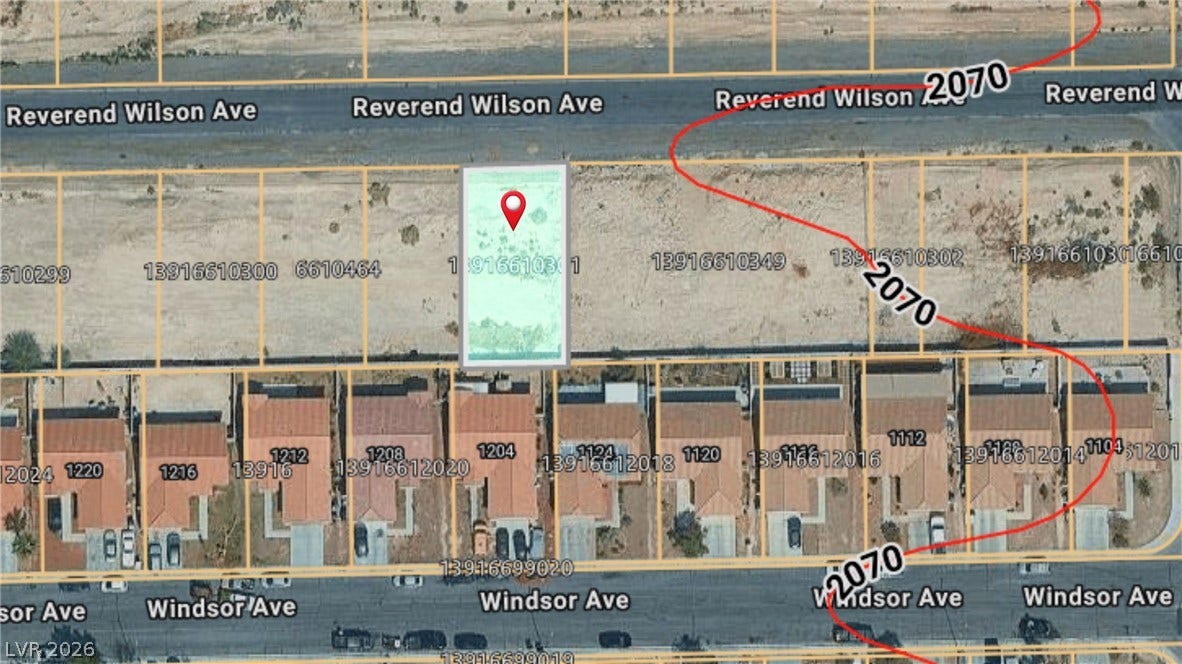 0 Reverend Wilson Drive, North Las Vegas, NV 89030 An aerial plat map outlines the parcel boundaries relative to nearby streets and residential properties.