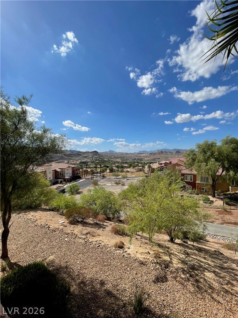 30 Via Vasari, #102, Henderson, NV 89011 Scenic mountain vistas and neighboring valley views unfold under a wide desert sky.