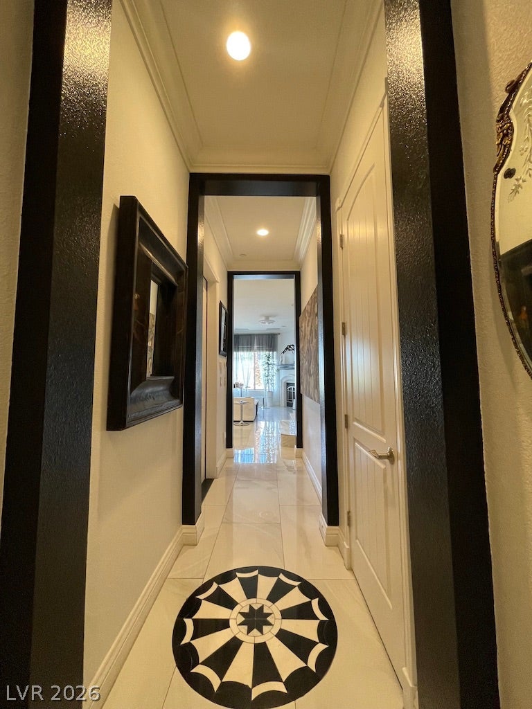 30 Via Vasari, #102, Henderson, NV 89011 High ceilings and polished tile floors define this elegant arched hallway layout.
