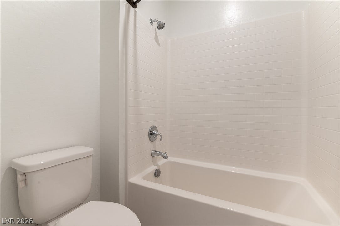 5740 Saltrock Grove Street, North Las Vegas, NV 89081 A classic shower and tub combination features clean subway tile walls.
