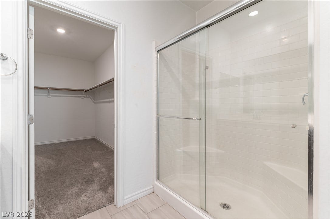 5740 Saltrock Grove Street, North Las Vegas, NV 89081 Clean lines and classic subway tile define this functional bathroom layout.