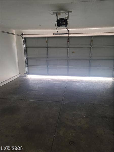3123 Inlet Bay Avenue, North Las Vegas, NV 89031 Smooth concrete floors and a modern automatic door define this clean garage space.