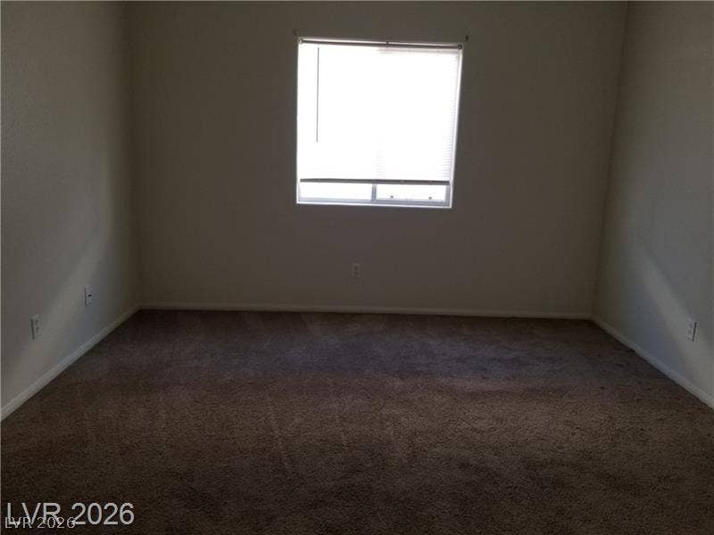 3123 Inlet Bay Avenue, North Las Vegas, NV 89031 Soft carpeting pairs with a central window to create a quiet, comfortable space.