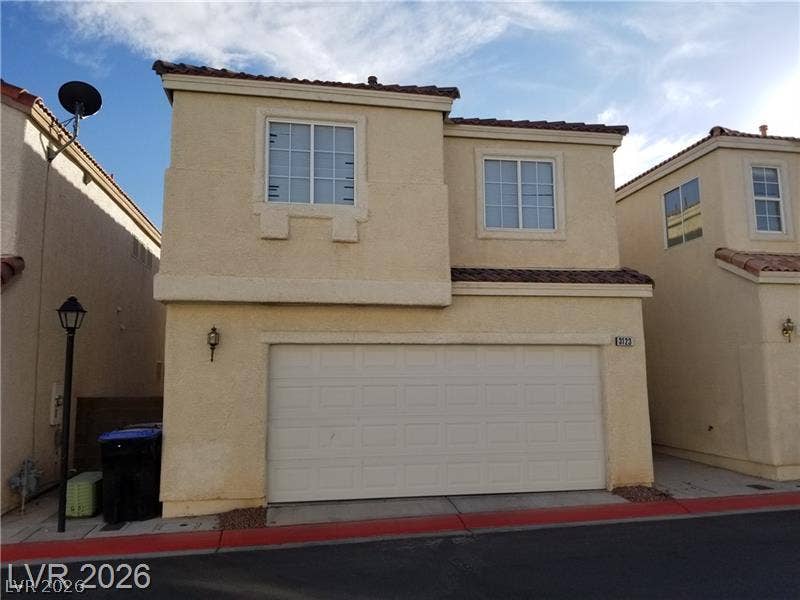 3123 Inlet Bay Avenue, North Las Vegas, NV 89031 An attached two car garage grounds this multi-level home under classic tile roofing.