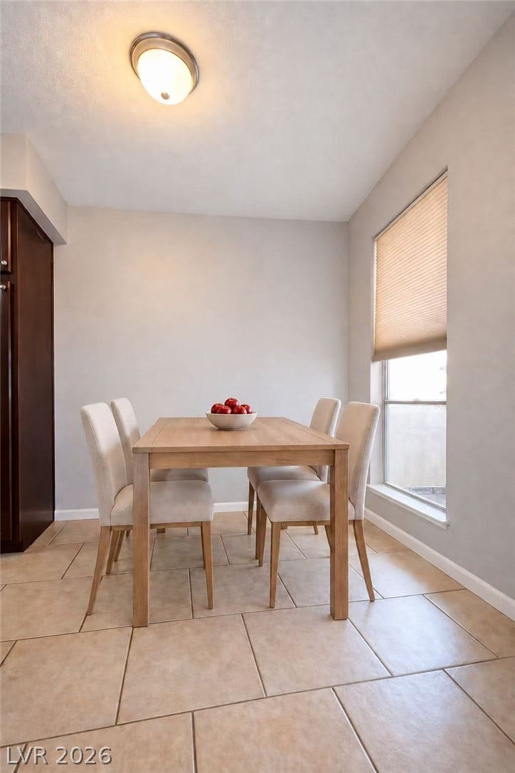 2838 Loveland Drive, #1608, Las Vegas, NV 89109 Tiled flooring and a tall window define this comfortable dining area.