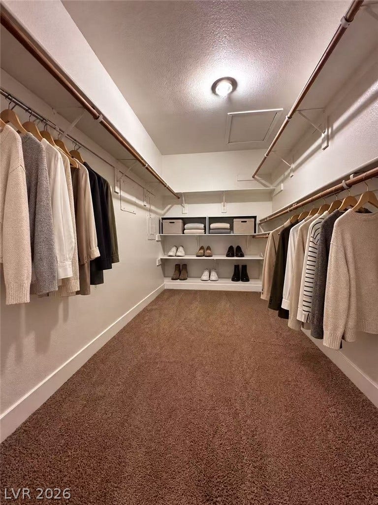 2838 Loveland Drive, #1608, Las Vegas, NV 89109 An organized walk-in closet includes wall-to-wall carpeting and built-in shelving systems.