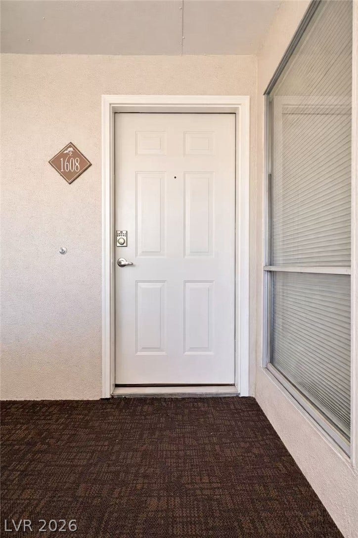 2838 Loveland Drive, #1608, Las Vegas, NV 89109 A welcoming front entry features a classic paneled door and large adjacent window.