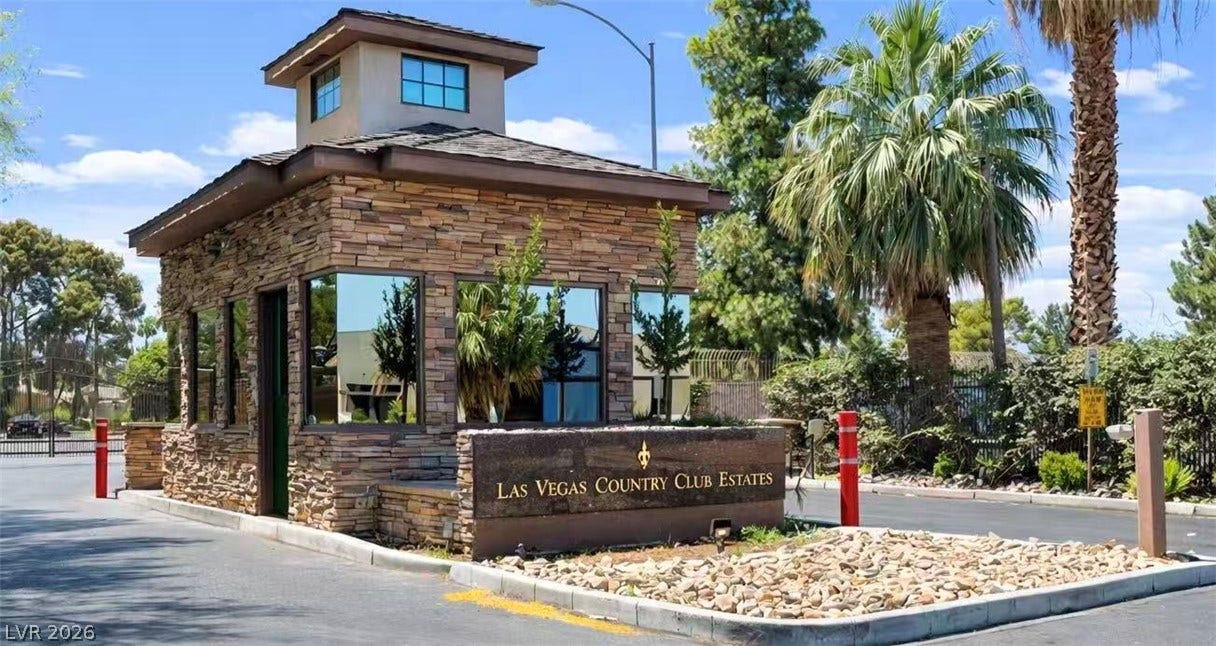 2838 Loveland Drive, #1608, Las Vegas, NV 89109 Secure stone gatehouse guards the entrance under clear desert skies.